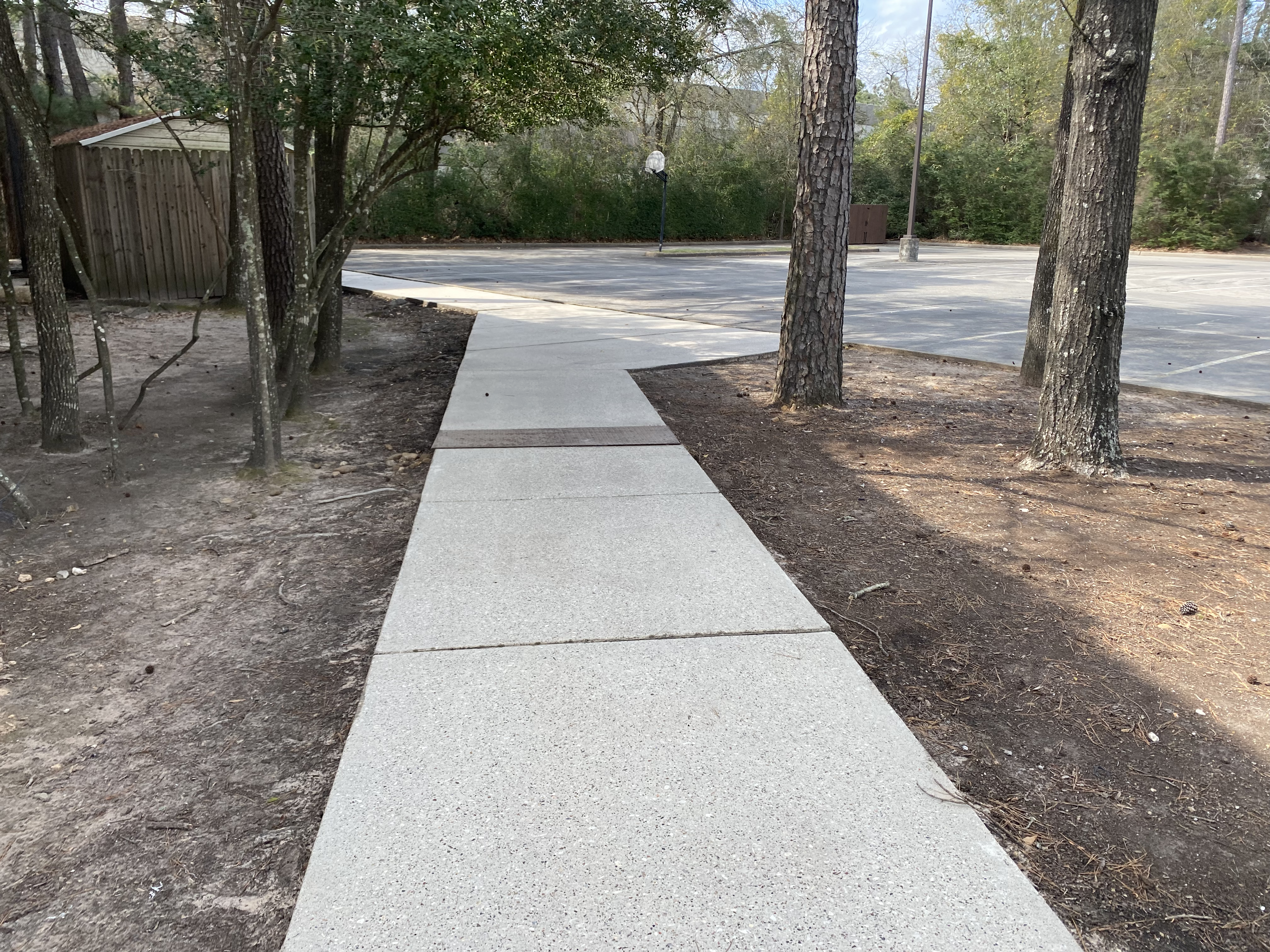 Kinton Pressure Washing and Cleaning cleaned an office building and concrete sidewalk in the Woodlands, TX.